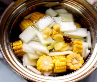 Cooking Corn and Winter Melon Pork Rib Soup in A Boiling Pot Off The Fire recipe
